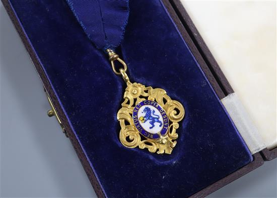 A 1930s 9ct gold and enamel commemorative medallion, inscribed en verso.